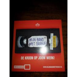 Nieuwe DVD De Kroon op Jouw Werk/Mijn Band met Oranje