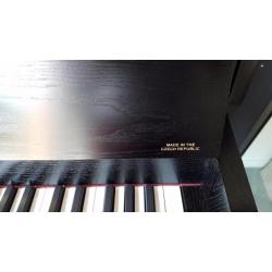 Gebruikte Europese piano Petrof/Rieger Kloss 108 zwart mat
